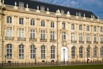 Fototapeta na wymiar Stoned building typical facades of Bordeaux city in France