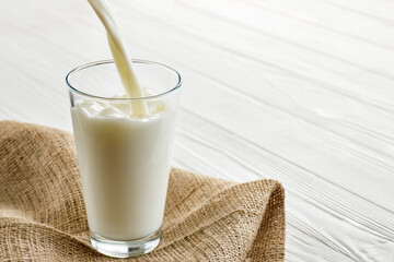 milk pouring into glass