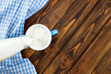 milk pouring into cup