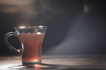 A bar of milk chocolate. Homemade milk chocolate with almonds and dried strawberries. Pieces of milk chocolate. Set of milk chocolate with tea.