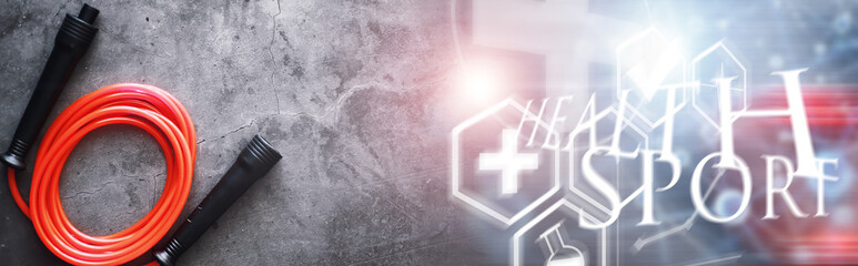 Jump rope. Physical education. Sports exercise equipment. Rope exercises routine. Pink jump rope phone with a stopwatch and water on the table.