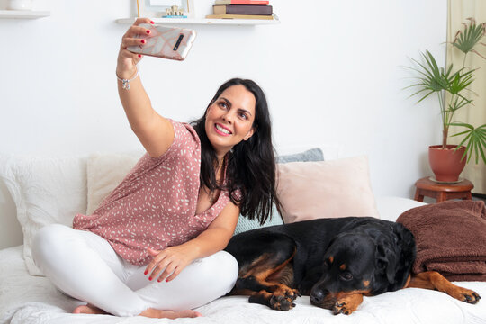 woman take selfie with dog