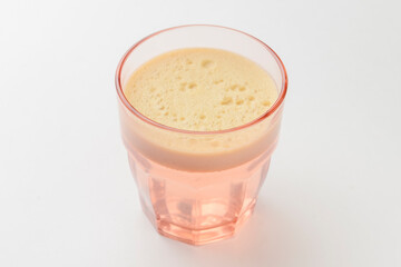 Isolated citrus juice. One glass with orange, grapefruit or lemon juice isolated on white background.