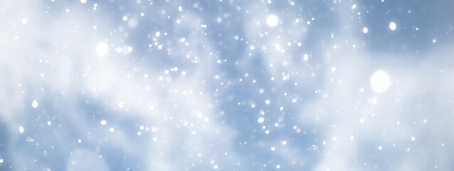 Fototapeta premium blue snowfall bokeh background, abstract snowflake background on blurred abstract blue