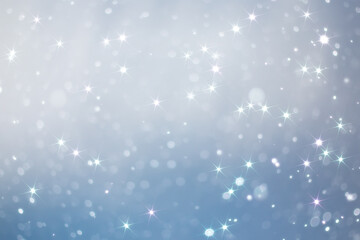Obraz na płótnie Canvas blue snowfall bokeh background, abstract snowflake background on blurred abstract blue