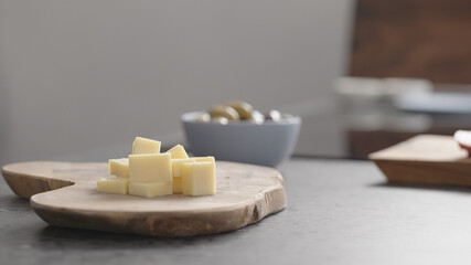 vintage hard cheese pieces on olive wood board