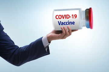 Businessman in covid-19 coronavirus vaccination concept