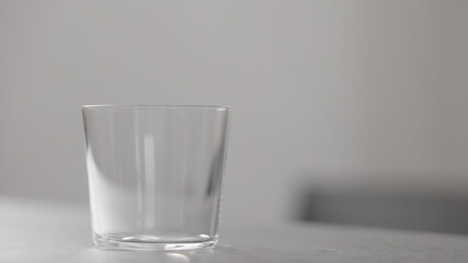 tumbler glass on concrete countertop with copy space