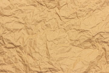 The texture of crumpled brown craft paper.