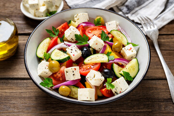 Classic Greek salad with fresh vegetables, feta cheese and  olives. Healthy food.