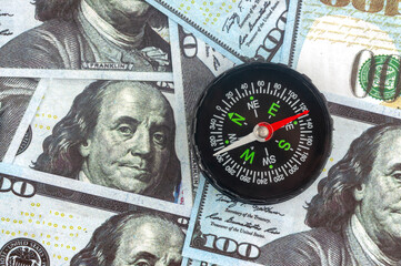 dollars and compass, the concept of currency volatility