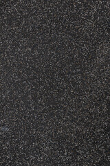 closeup texture of an dark asphalt road, the pattern is  looking like a starfield. - vertical