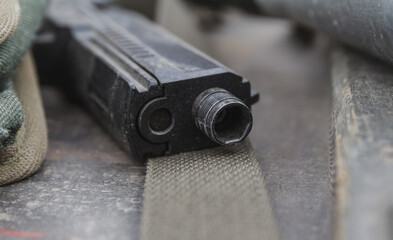 Close-up of the barrel of a pistol.