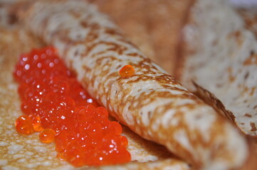 Butter pancakes with red caviar