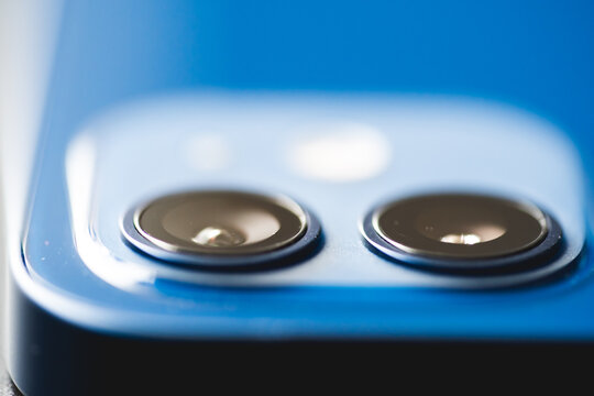 February, 2021: Back view of new blue smartphone. Two lens close up.