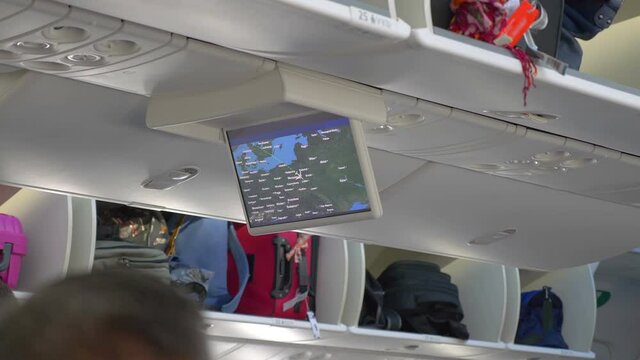 LCD monitor showing a map in the airplane in 4K slow motion 60fps