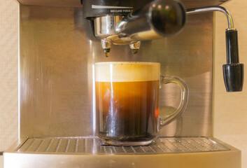 coffee maker pouring espresso