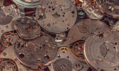 Details of an old mechanical watch close-up. Selective focus on details. Grunge background of vintage clock elements
