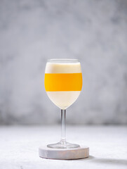 Italian dessert panna cotta with tangerine jelly layer in a glass