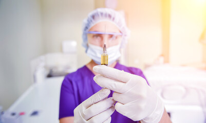 Platelet-Rich plasma preparation. Syringe with plasma in hands