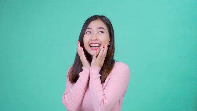 Beautiful smiling of young asian woman with retainer braces with white teeth glad emotion