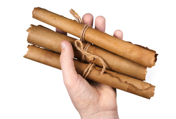 Man holding ancient paper scrolls.