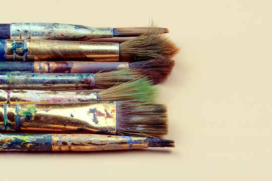 Art brushes in paint close-up