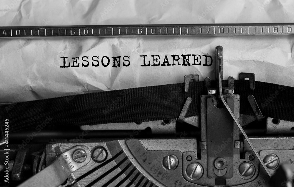 Poster text lessons learned typed on retro typewriter