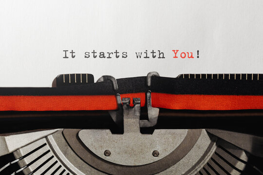 Text It starts with You typed on retro typewriter