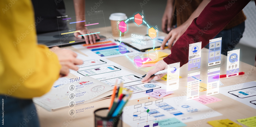 Aufkleber Close up ux developer and ui designer use augmented reality brainstorming about mobile app interface wireframe design on desk at modern office.Creative digital development agency