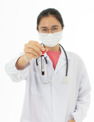 Obraz premium Portrait of Asian female doctor in white gown coat wearing eyes glasses in white background holding test tube of coronavirus covid 19 vaccine sample