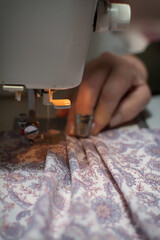 Obraz premium Hands Of A Dressmaker Creating A New Design Of Clothes. Sewing workshop.