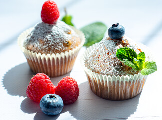 cupcakes with berries and mint