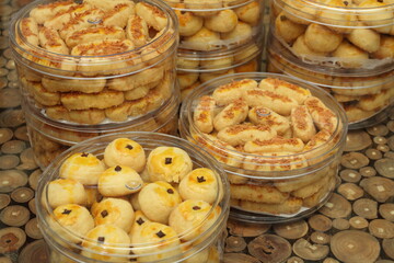 Some jars of Nastar and Kaasstengels cookies on the table