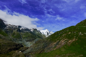 Fototapeta na wymiar wonderful white mountain with a sharp peak and blue sky