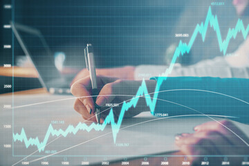 Double exposure of forex chart drawing over people taking notes background. Concept of financial analysis