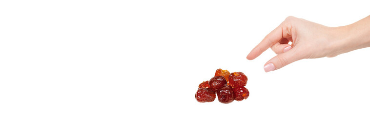 Hand with dried date isolated on white background.