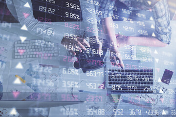 Double exposure of man and woman working together and financial graph hologram drawing. market...