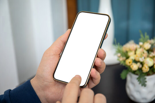 man holding gold phone with isolated screen in hands