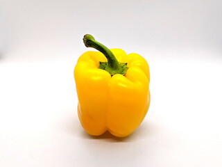 yellow bell pepper. one yellow bell pepper on a white background side view