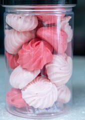 Merang in the bottle on front of black ground