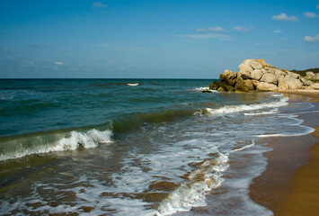 Beach by the rocks on the shores of the Azov Sea.