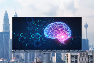 Brain hologram on billboard with Kuala Lumpur cityscape background at day time. Street advertising poster. Front view. KL is the largest science hub in Malaysia, Asia. Coding and high-tech science.