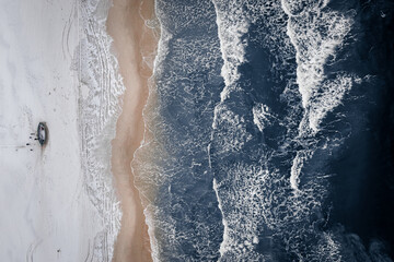 Fishing boats on snowy beach, Baltic Sea, Poland