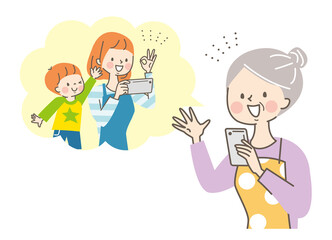 スマホで娘と孫と通話するシニア女性