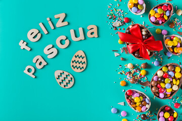 Festive Easter background with chocolate eggs and sweets