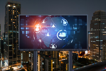 World planet Earth map hologram and social media icons on billboard over night panoramic city view of Bangkok, Southeast Asia. Networking and establishing new connections between people. Globe