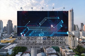 Glowing hologram of technological process on billboard, aerial panoramic cityscape of Bangkok at sunset. The largest innovative hub of tech services in Southeast Asia.