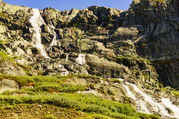 Waterfall in mountains. Norwegian route Sognefjellet