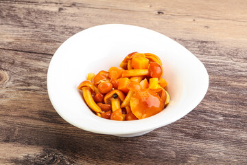 Marinated pickled honey mushrooms in the bowl